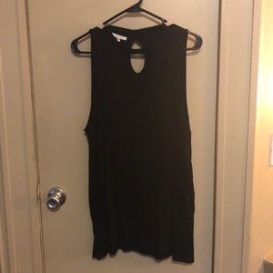 Black sleeveless top.